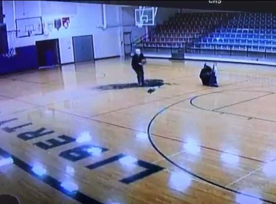 Watch This School Janitor Hit the Most Casual Backwards Half-Court Shot of All-Time