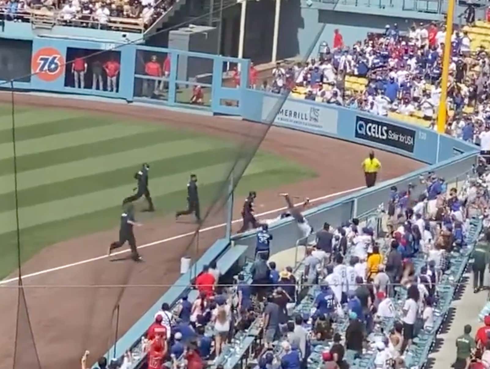 The Dodgers Ball Girl Just Took Out a Fan Running Across the Field Like