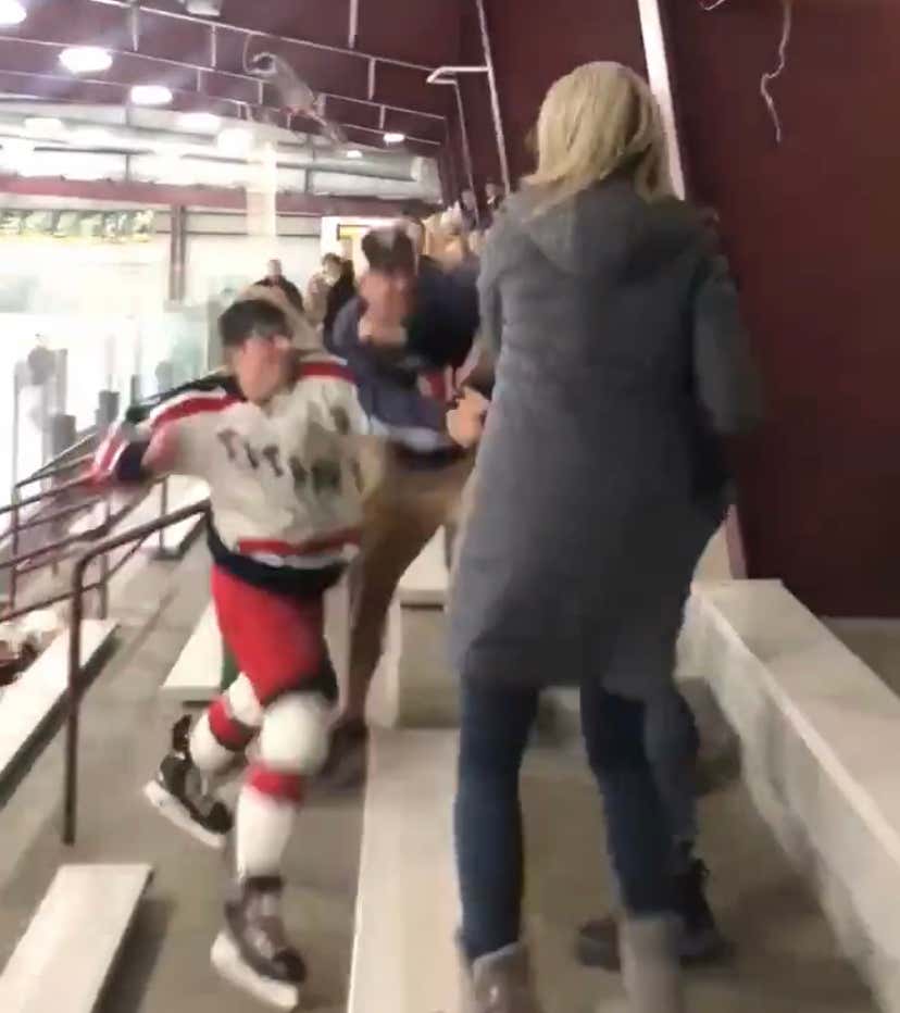 High School Hockey Player Decides To Call It A Career, Runs Up Into Stands To Fight A Parent