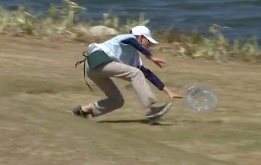 Nobody Is More Dedicated To Their Job Than This Volunteer Chasing Down A Rogue Piece Of Trash At The WGC-Dell Technologies Match Play