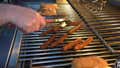 Tank Cooks Hot Dogs on the Grill