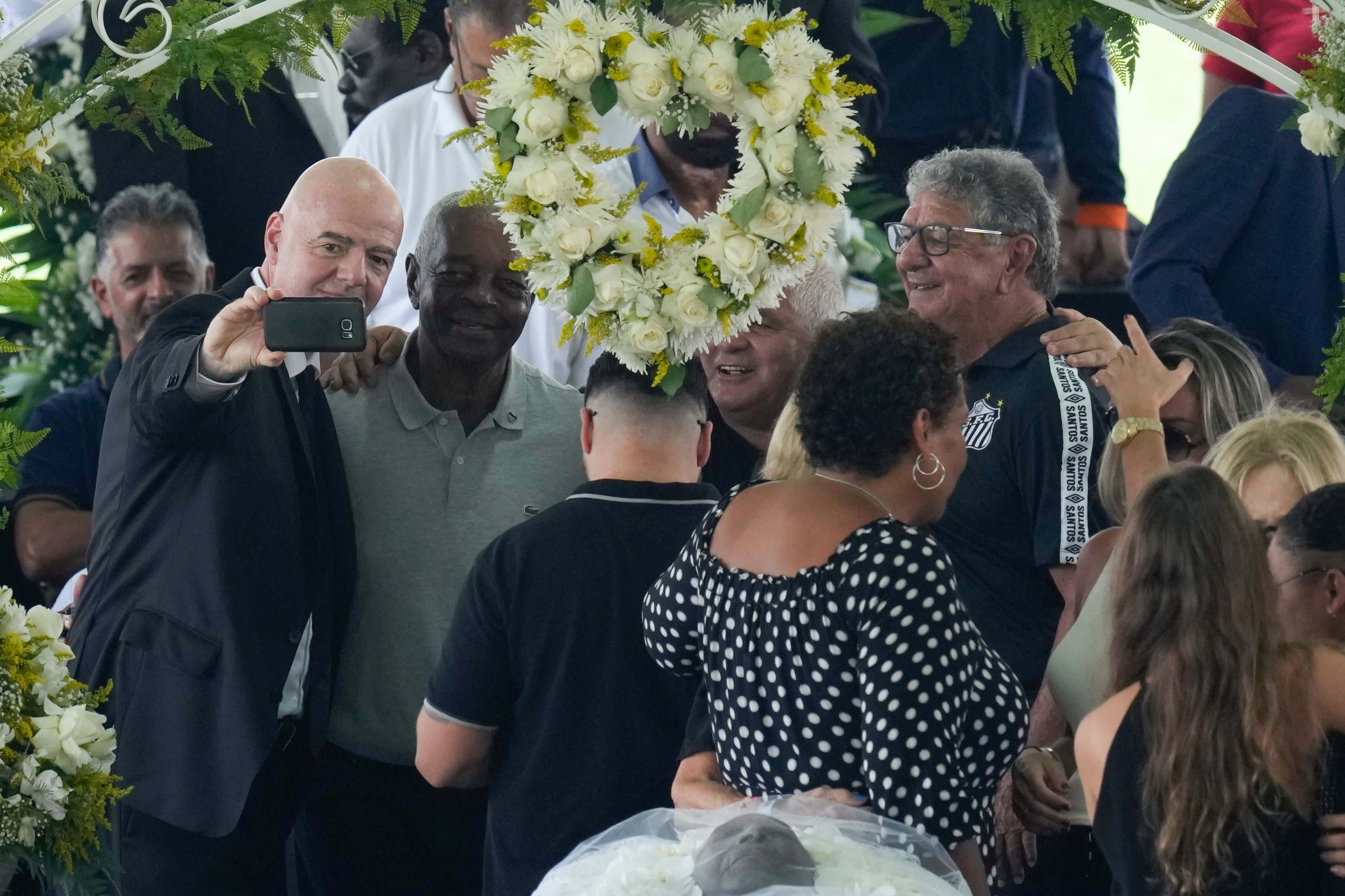 That Buffoon Gianni Infantino, The Head Of FIFA, Is Getting Roasted For Taking A Selfie In Front of Pele's Casket During His Wake