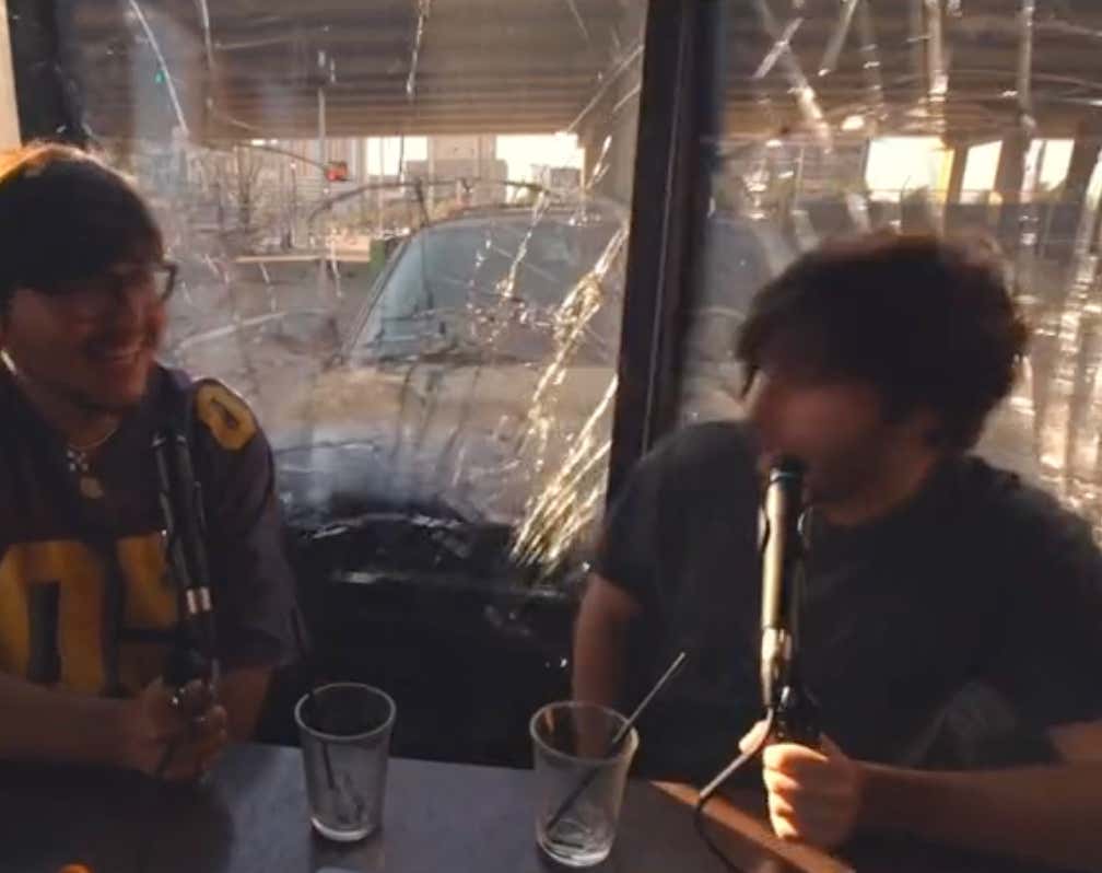 WILD Video Of A Car Crashing Through A Coffee Shop While Two People Were Recording A Podcast