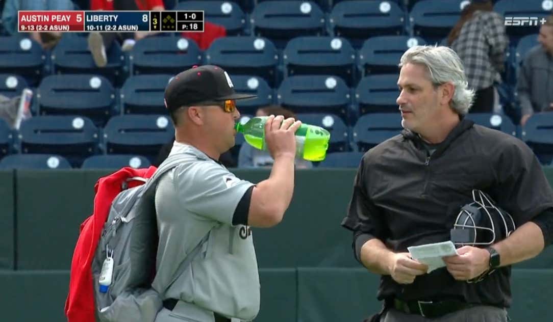 Getting Tossed From The Game Isn't Going To Stop This College Baseball Coach From Slugging Down His Gameday 2-Liter Of Mountain Dew