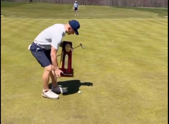 Carrying The National Championship Trophy Around For 18-Holes And Using It As Your Ball Marker Is The Ultimate Power Move