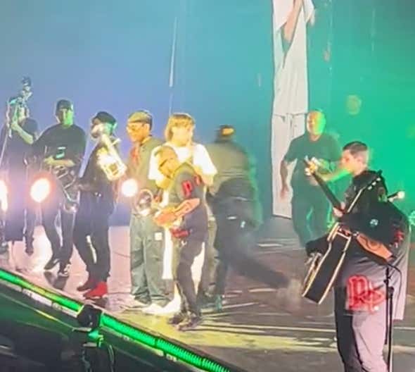 Some Dude Ran On Stage During Peso Pluma's Concert, Security Guard Delivers A Perfect Truck Stick To Send Him Flying