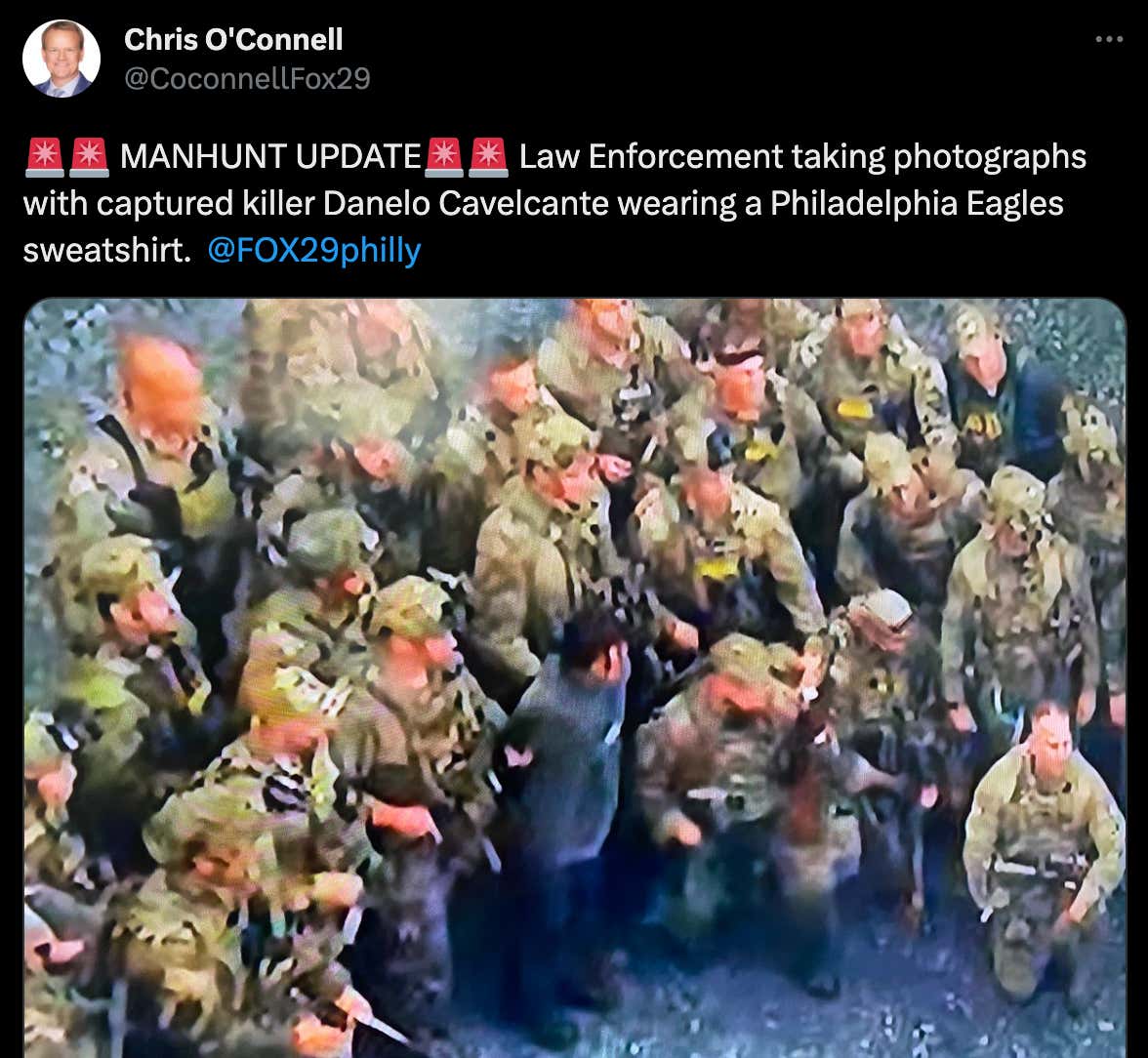 Lining Up For A Team Photo After Finally Capturing An Escaped Murderer Who Was On The Run For Two Weeks Is Objectively Hilarious