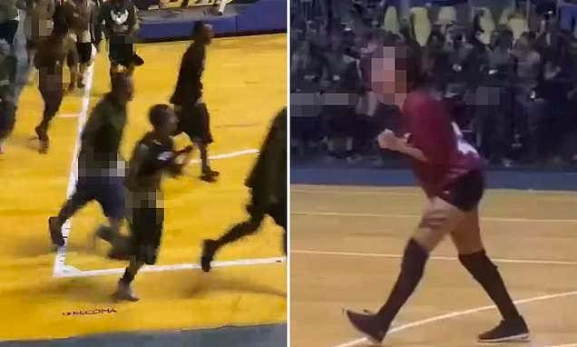 A Bunch of Medical Students Celebrate a Win by Their School's Volleyball Team by Storming the Court and Holding a Circle Jerk