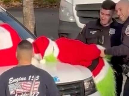 This Grinch Stealing The Presents Video From A Firehouse Christmas Party Goes Next Level Getting The Cops Involved ... And All For A Good Cause