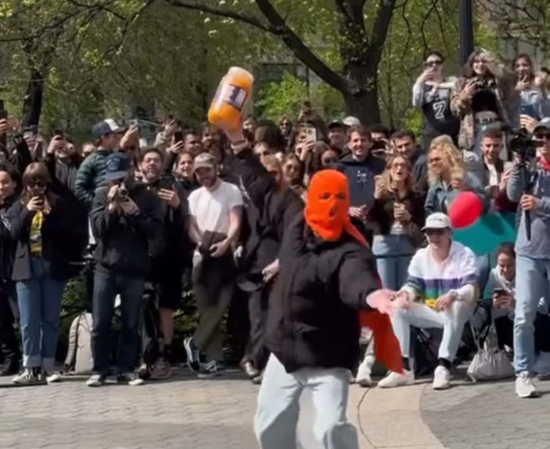 Thousands Gather In NYC To Watch 22-Year-Old Man Eat A Jar Of Cheeseballs.....But Some Are Calling Him A FRAUD?!?