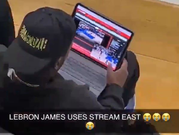 Billionaire LeBron James Caught on Sidelines of a Basketball Game Using Illegal Stream to Watch Conference Finals