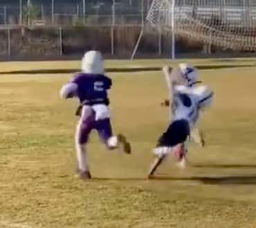Whatever The Record Is For Most Stiff Arms On One Run Is, I Think This Kid Just Broke It