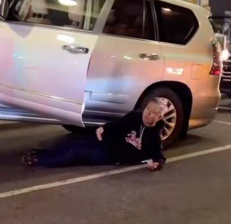 A Guy Tried To Prevent His Car From Being Towed Away By Laying Under It