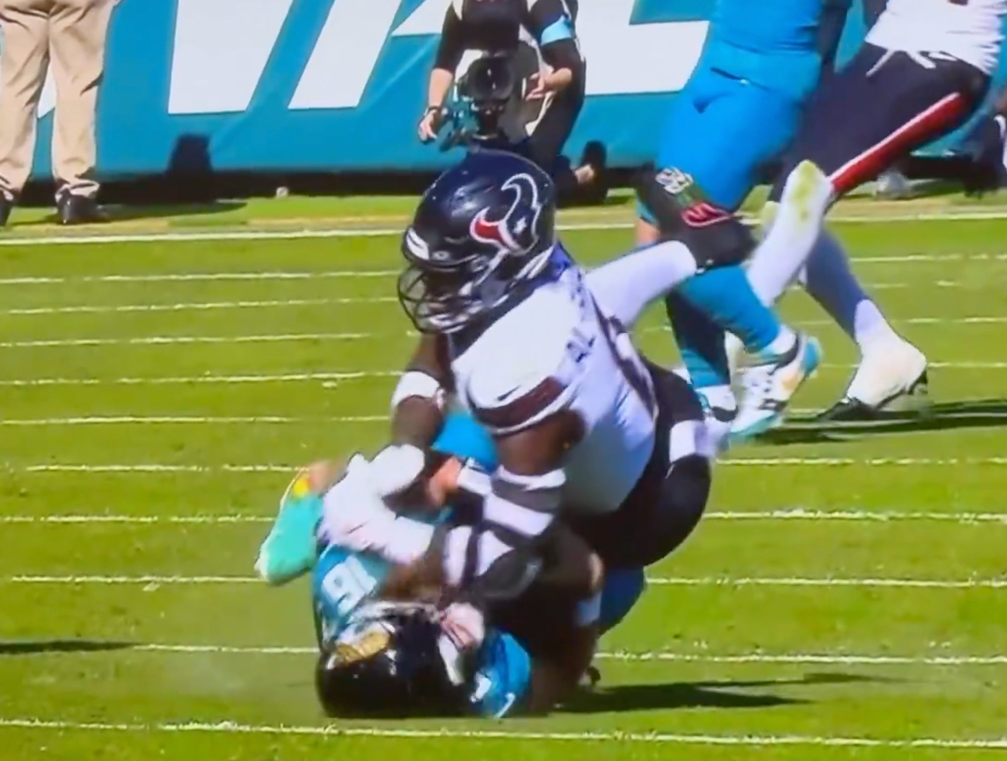 An Ugly Scene Unfolded In Jacksonville After A Dirty Hit On Trevor Lawrence By Texans Linebacker Azeez Al-Shaair, Complete With An On-Field Brawl And Fans Throwing Trash