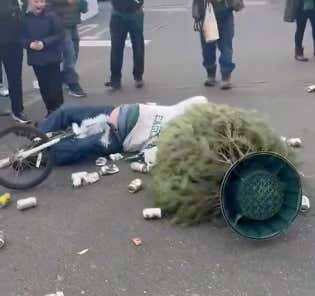 Top Scientists Can't Explain How Violent This Drunk Eagles Fan Crashing Into A Beer Can Christmas Tree Sounded