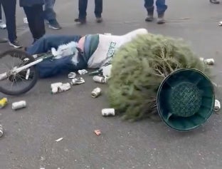 Top Scientists Can't Explain How Violent This Drunk Eagles Fan Crashing Into A Beer Can Christmas Tree Sounded