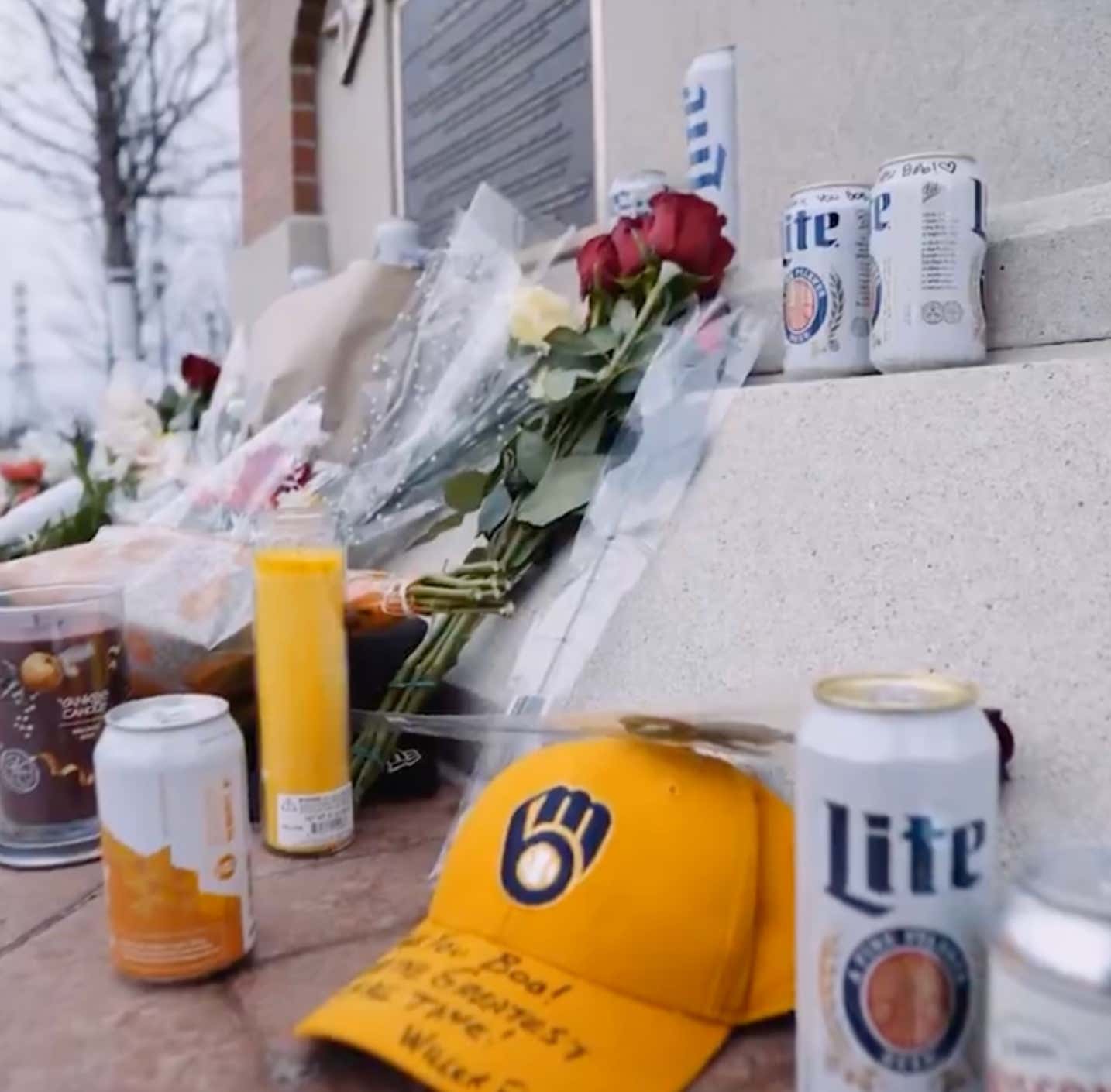 Brewers Fans Have Turned Bob Uecker's Statue Outside The Ballpark Into A Makeshift Memorial, Surrounding It With Flowers And Beer