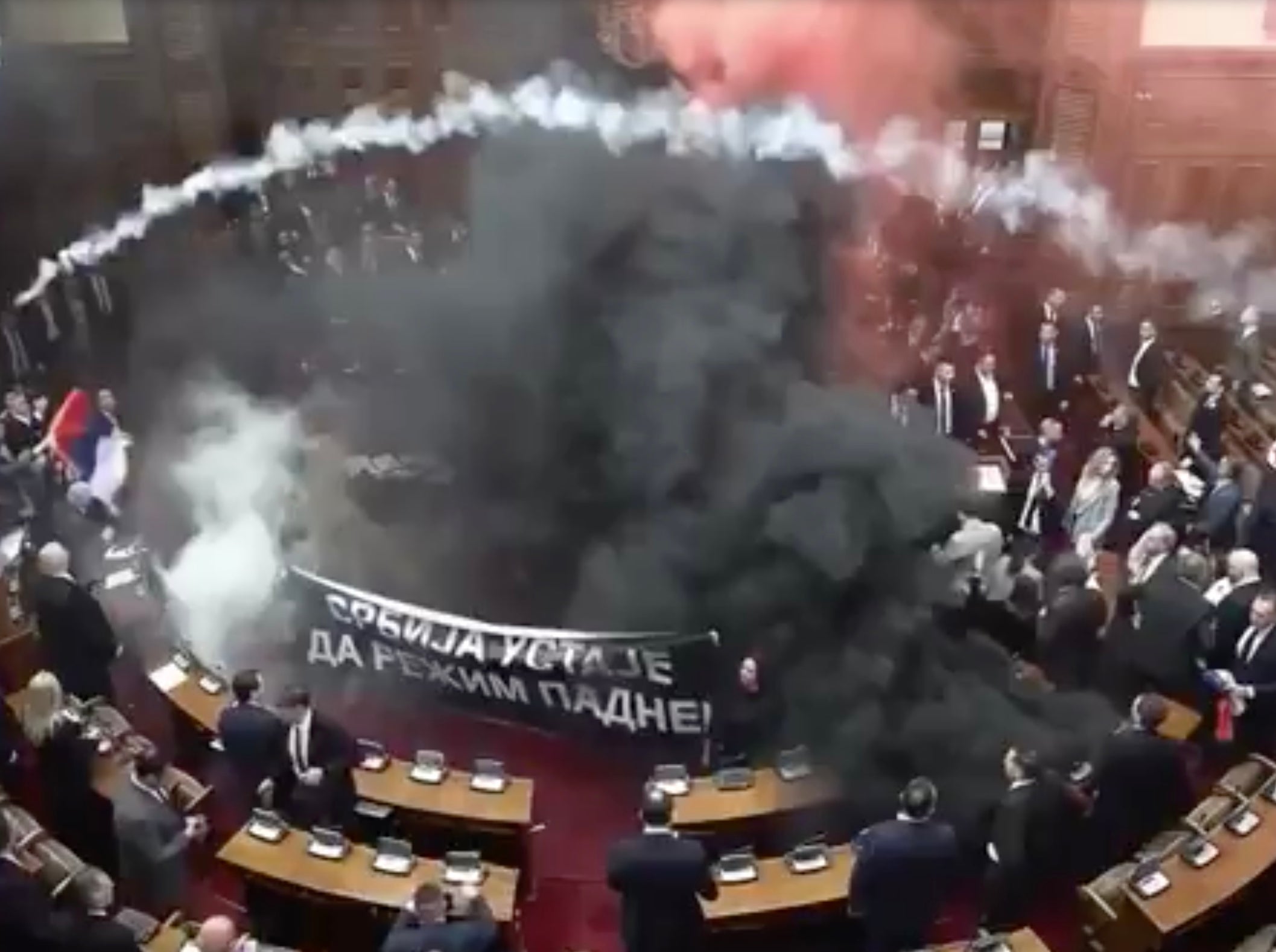 Serbian Parliament Session Devolves Into MP's Lighting Flares and Launching Smoke Grenades at Each Other