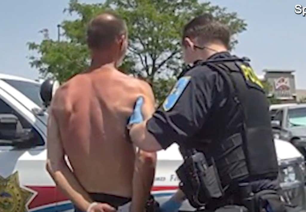 Every Person In This Parking Lot Is A Coward For Not Fighting This Man Who Was Seen Chugging Tobasco Sauce And Allegedly Challenging Random Strangers To Fight