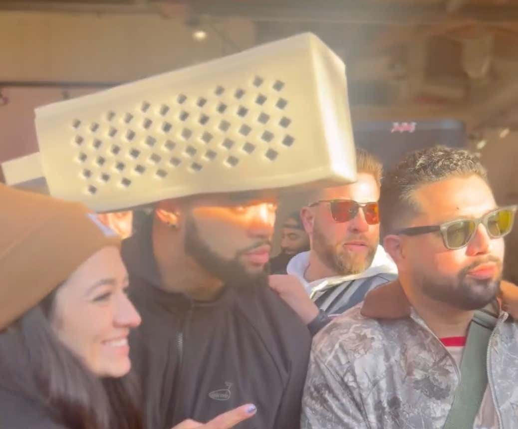 Caleb Williams Is Spending Victory Sunday Handing Out Meals To The Less Fortunate In A Cheese Grater Hat