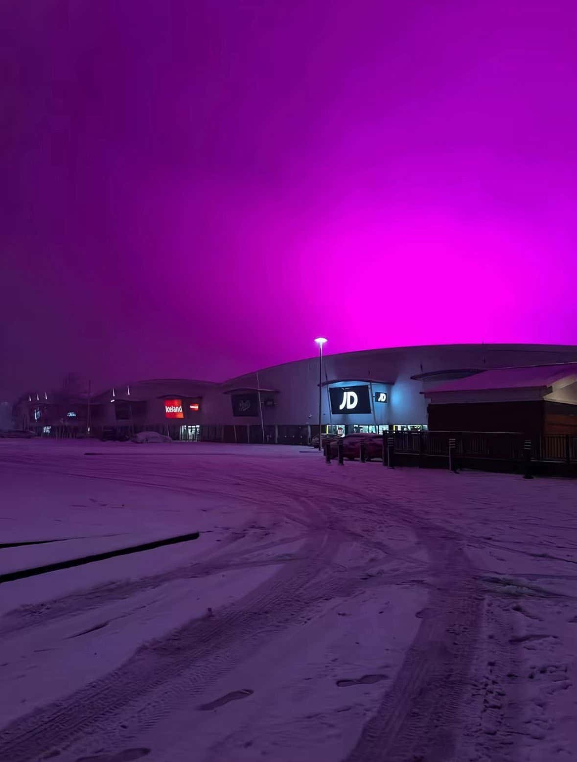 Birmingham Got A Pink Haze Across Their Sky After Their Football Stadium's LED Lights Reflected Off The Falling Snow And It Looked Unreal