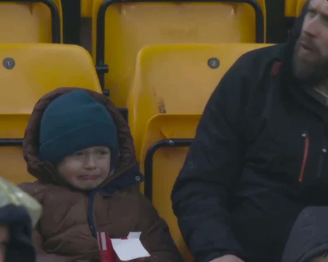 Little Soccer Fan Finds Out The Hard Way About The "Daddy Tax", As He Watches A Chicken Nugget Snatched Right In Front Of His Eyes