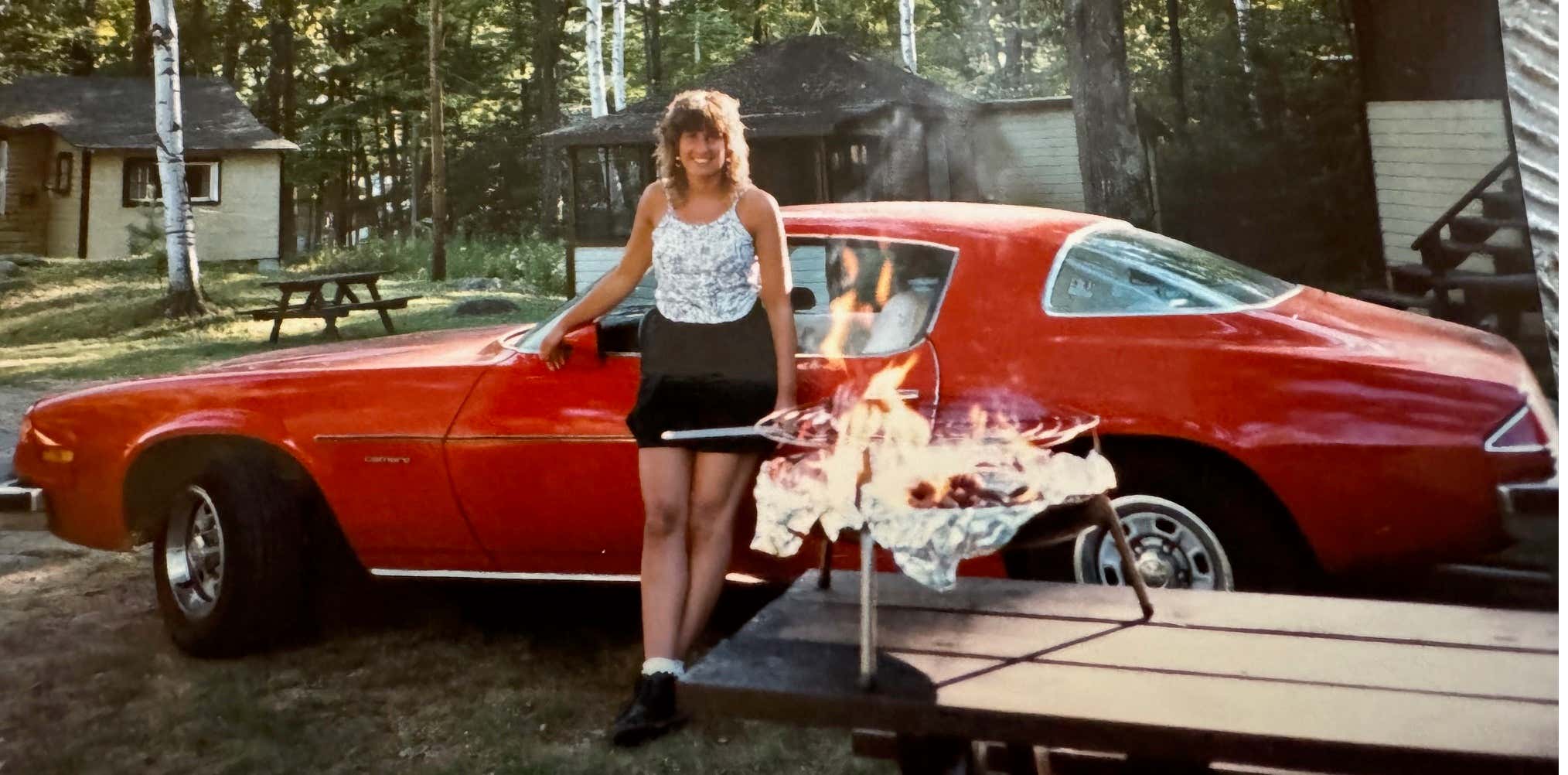 Susan's Smile Was the Only Thing That Outshined the Bright Orange Color of Her Camaro...