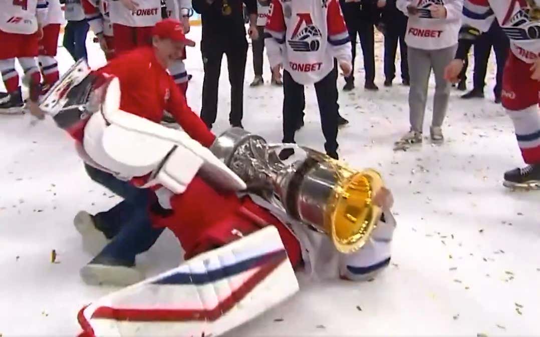 Russian Goalie Eats Shit Hoisting The Gagarin Cup (KHL's Stanley Cup), Which Appears To Be The Heaviest Trophy in The World