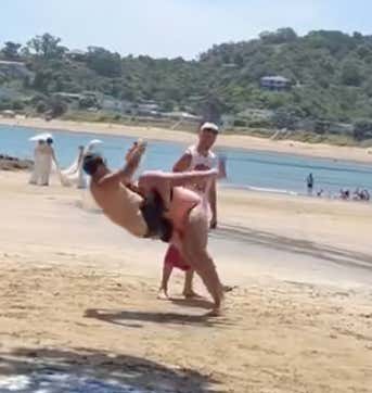 Girl Absolutely DEMOLISHES A Guy On The Beach During An Impromptu Tackling Drill And Someone Needs To Get Her To A Mini Camp PRONTO!