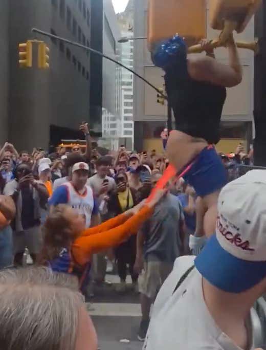 Woman Gets Brually Twerkmogged After Being Thrown From Light Post During The Knicks Parade
