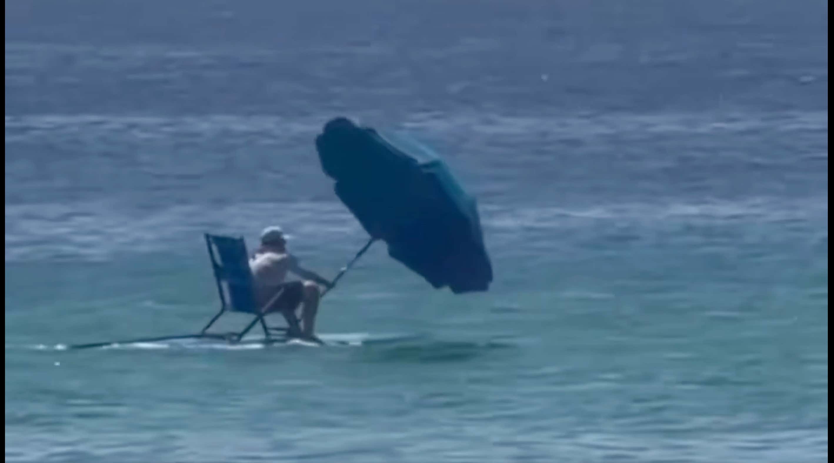 Real Man Of Genius: Florida Man Uses Umbrella and A Paddle Board To Windsurf