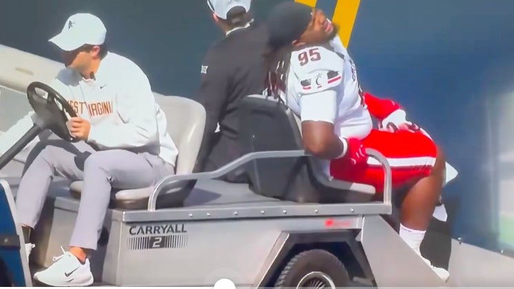 Head On A Swivel Out There: Dude Driving The Injury Cart At WVU Drives An Injured Cincinnati Player Directly Into The Wall