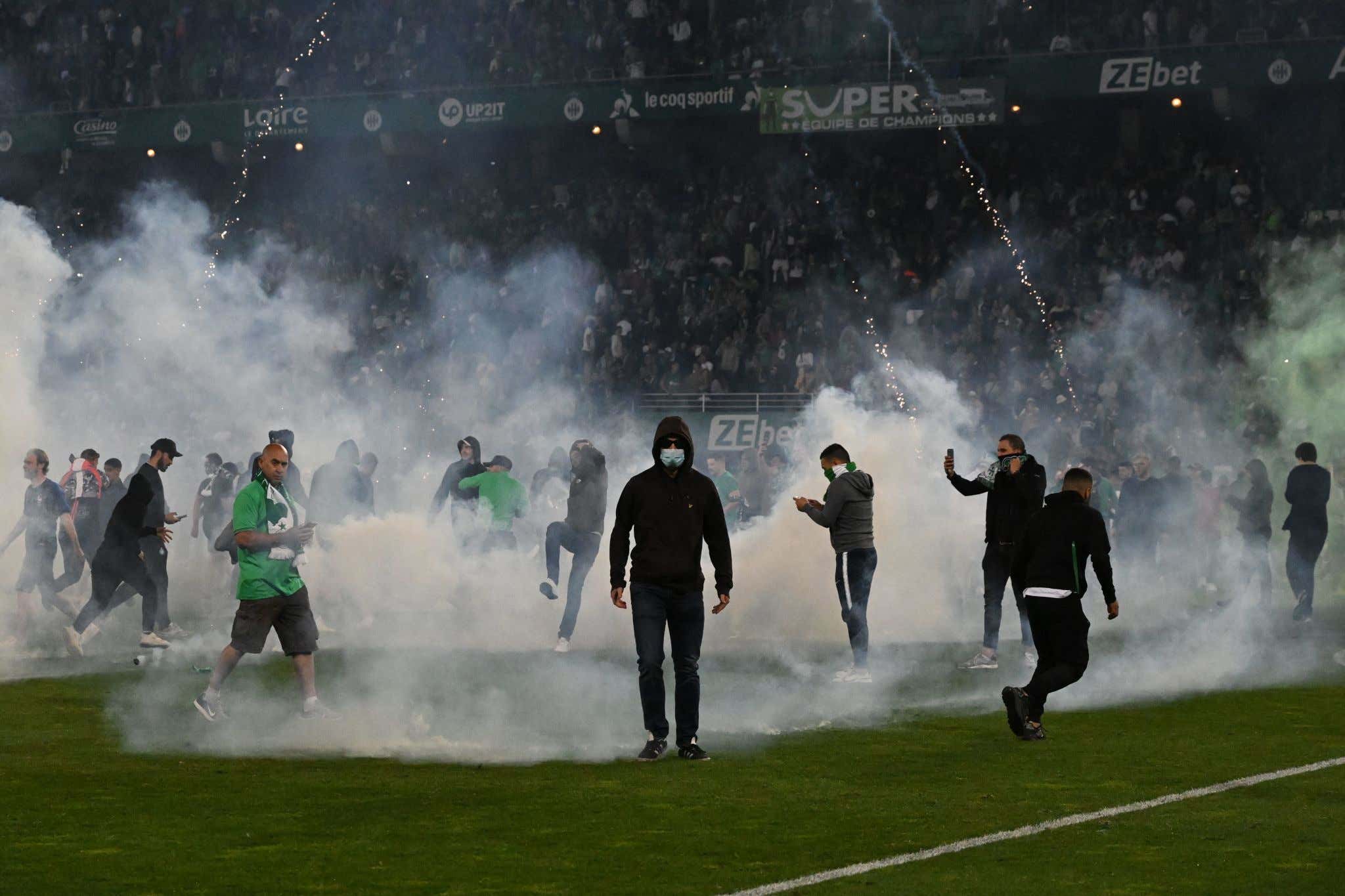 French Soccer Club AS Saint Étienne Was Relegated After PK's So Fans Reacted Calmly By Storming The Field And Throwing Flares At Players