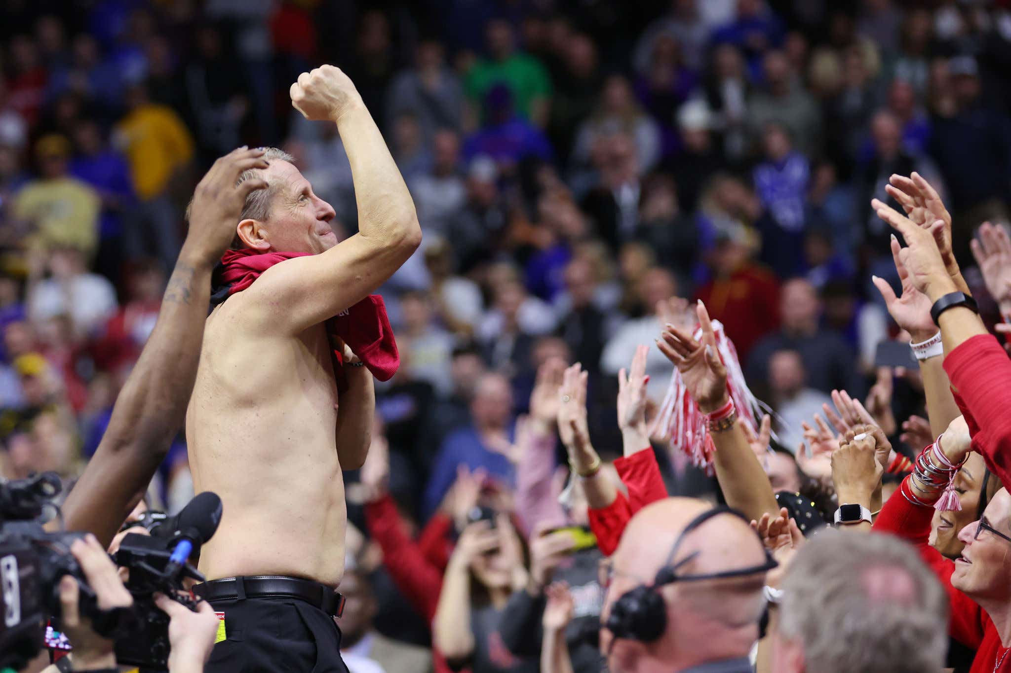 Power Move Tradition: Eric Musselman Rips His Shirt Off In The Crowd Immediately After Arkansas Upsets No. 1 Kansas