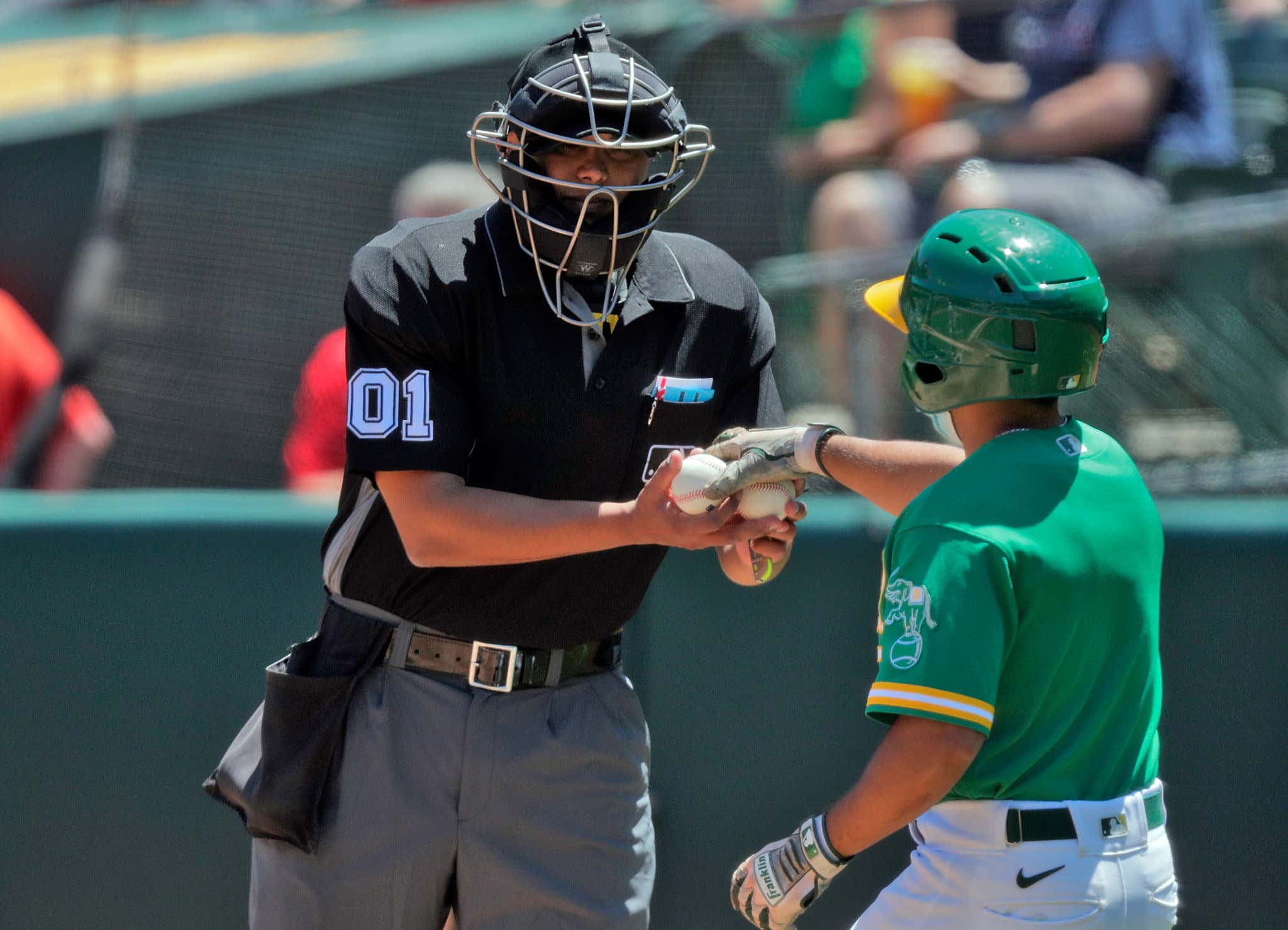 MLB umpires will wear mics to explain review rulings to fans starting this  season