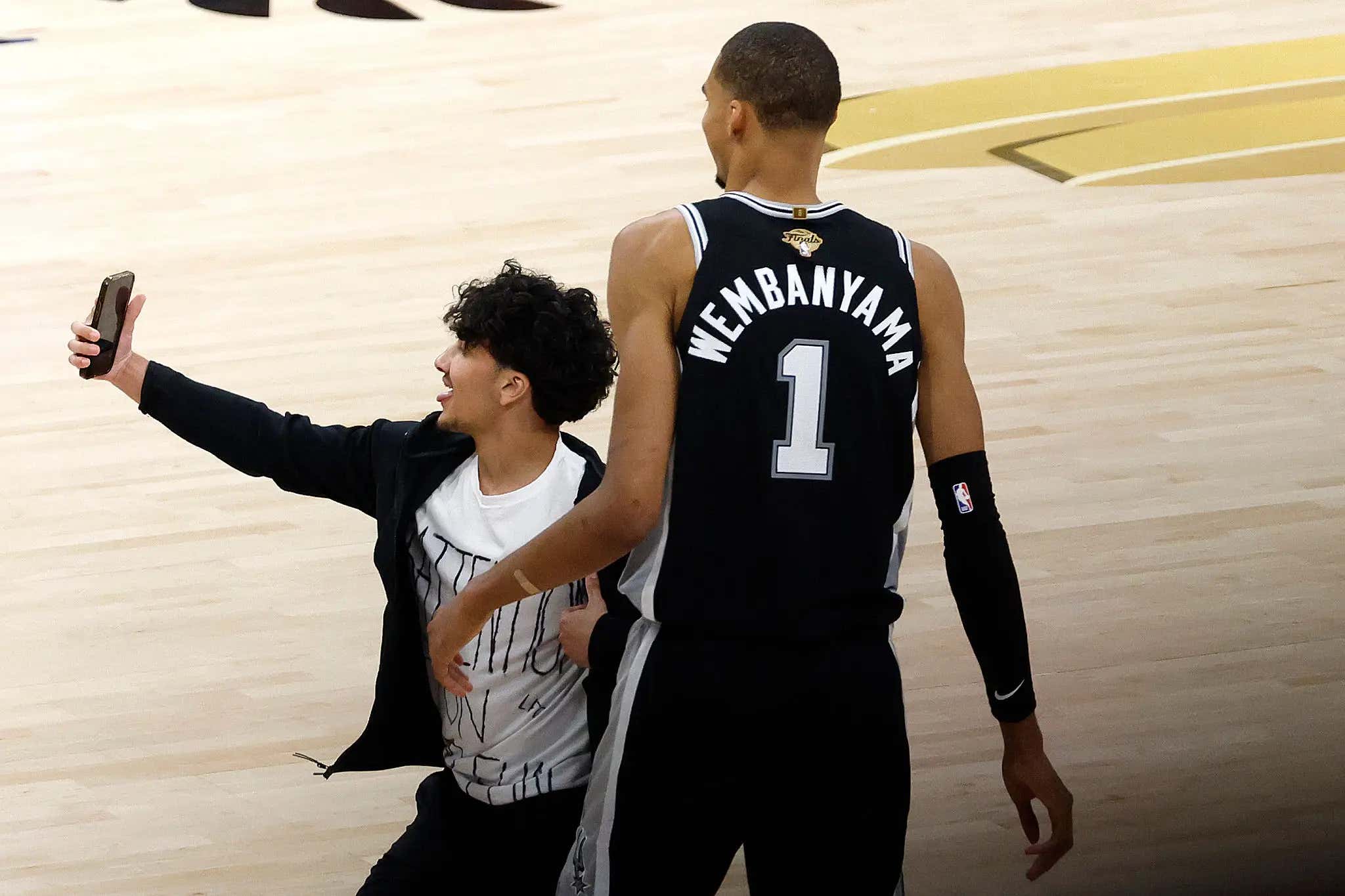 Some Jackass Fan Ran Onto The Court Right In The Middle Of The 4th Quarter Of Game 1 So He Could Get A Selfie With Wemby