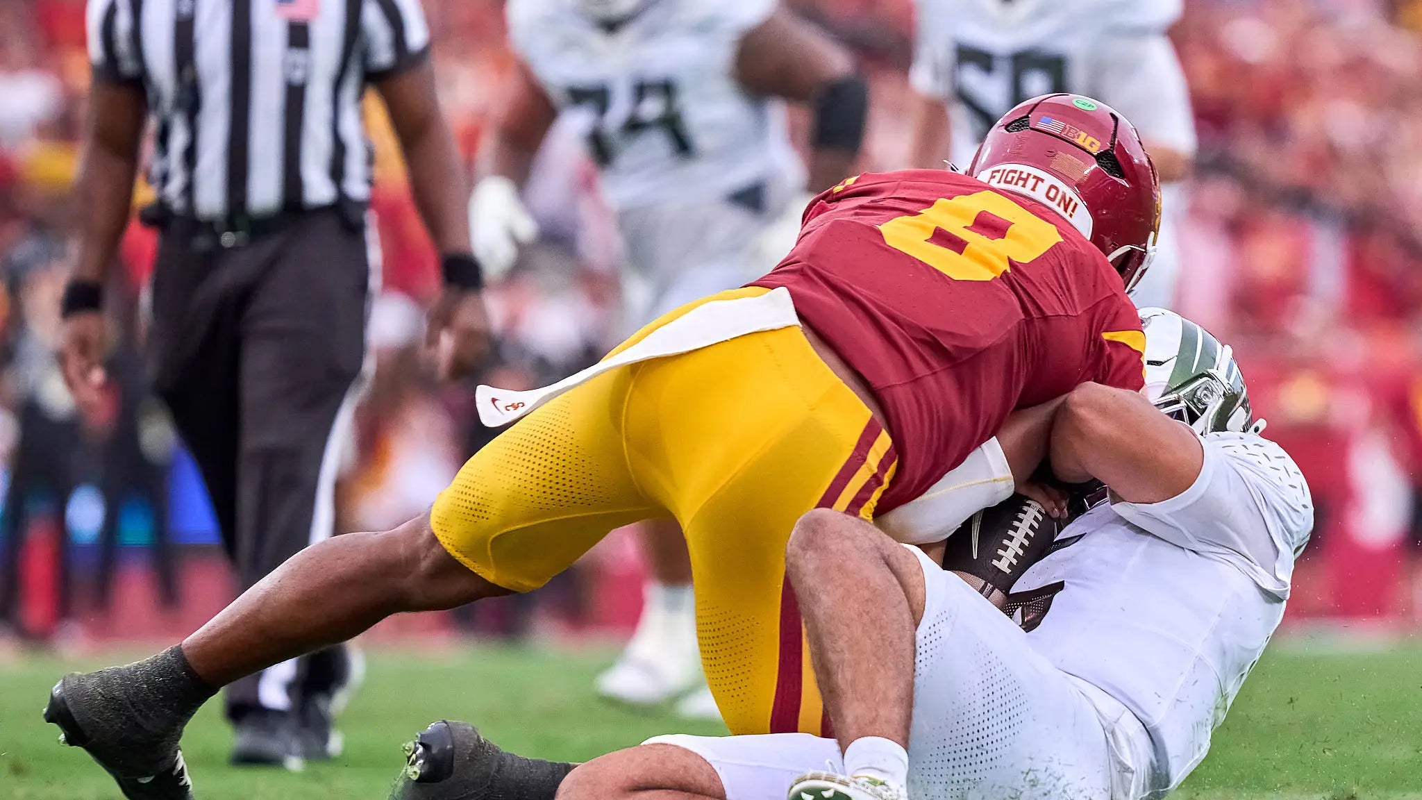 Dante Moore Is The Latest Victim Of The Most Obviously Stupid Allowable Act In Team Sports - The Quarterback Slide