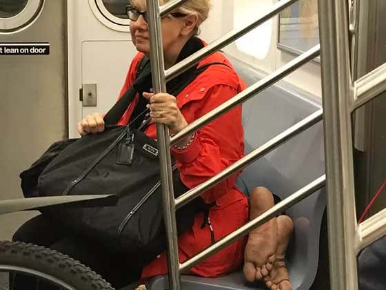 Touching Photo Of A Lady And Homeless Man Sharing A Seat On The Subway