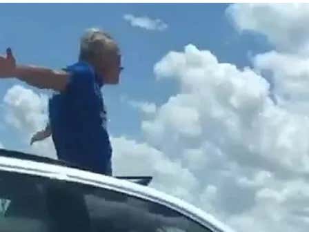 This Florida Man Demanding To Get Arrested To Avoid His Wife By Standing Through His Car's Sunroof At 100mph Is LIVING